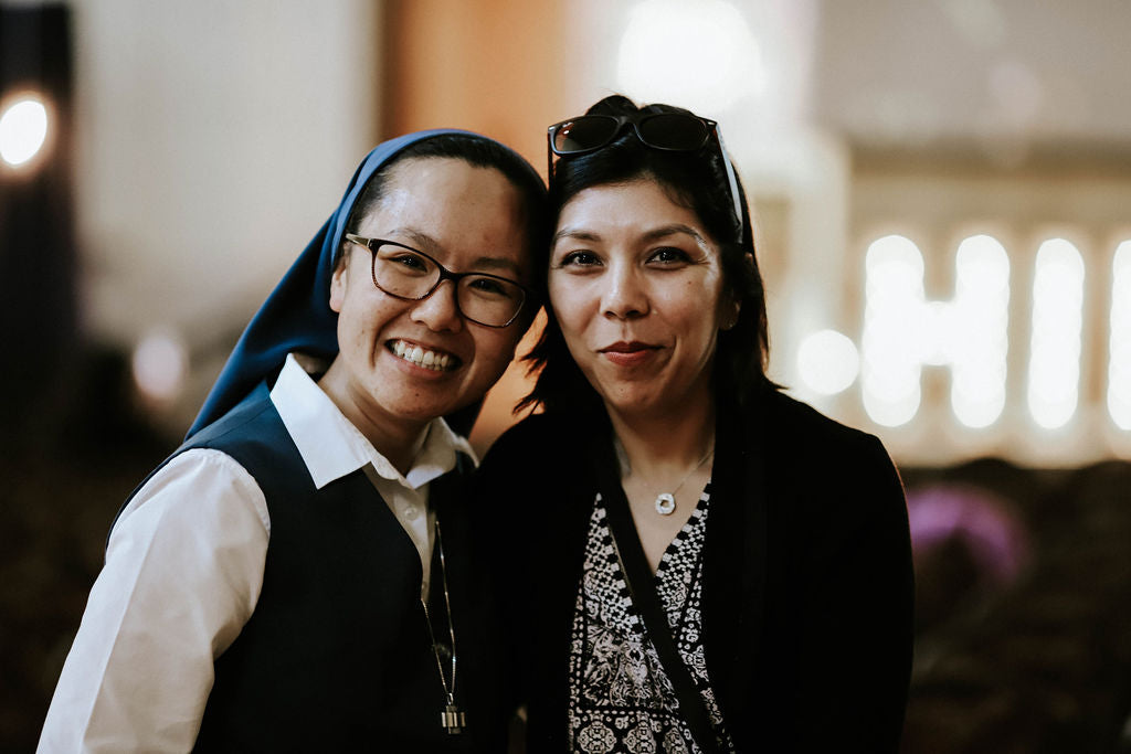 nun and woman smiling