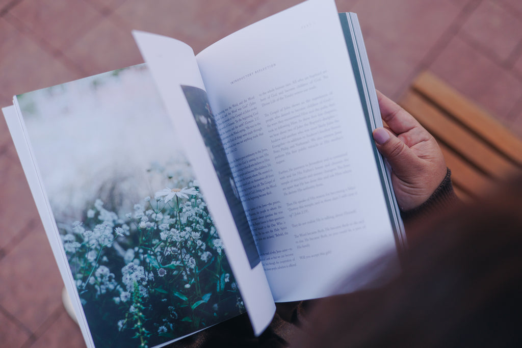 Open study book showing Scripture reflection and journaling space