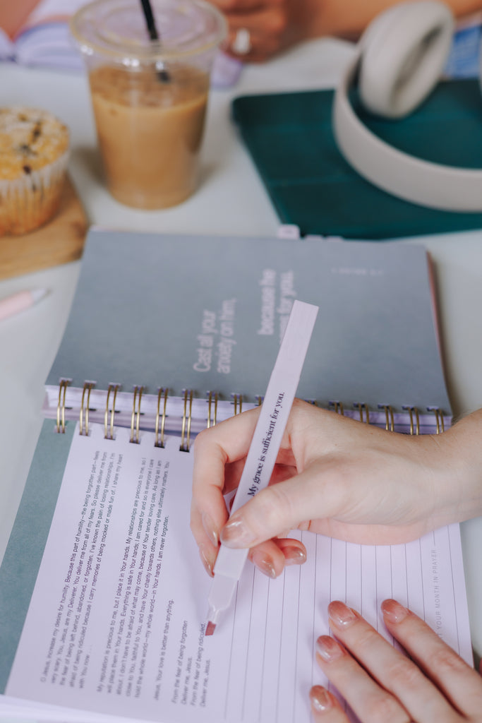 Close-up of fine-tip note-taking pen writing in a journal