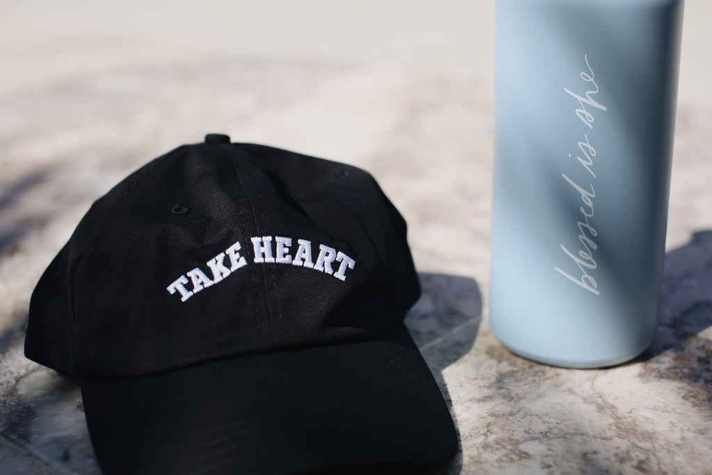 black hat with blue water bottle